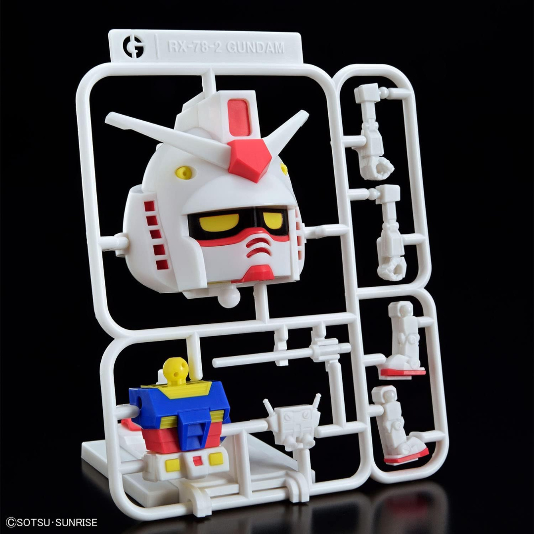 Scatola Gunpla-Kun DX Set Runner Ver Bandai: model kit chibi ispirato a RX-78-2, montaggio senza colla, stile kawaii, ideale per fan e collezionisti.

